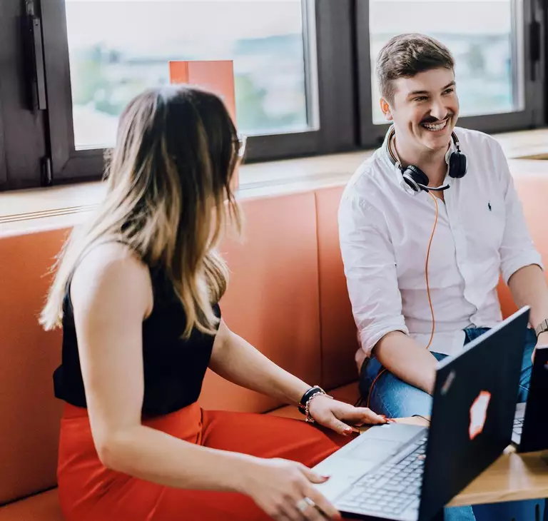 Students at WOLF students talking with eachother in the office